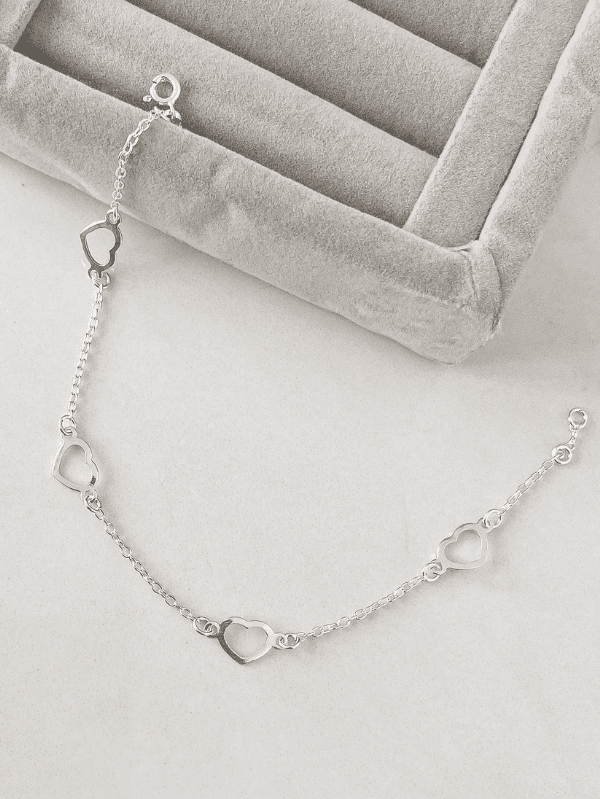Pulseira de Prata Entremeios Corações Vazados